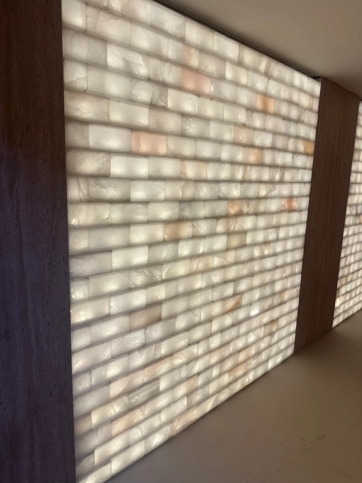 Close view of a softly illuminated white Himalayan salt wall