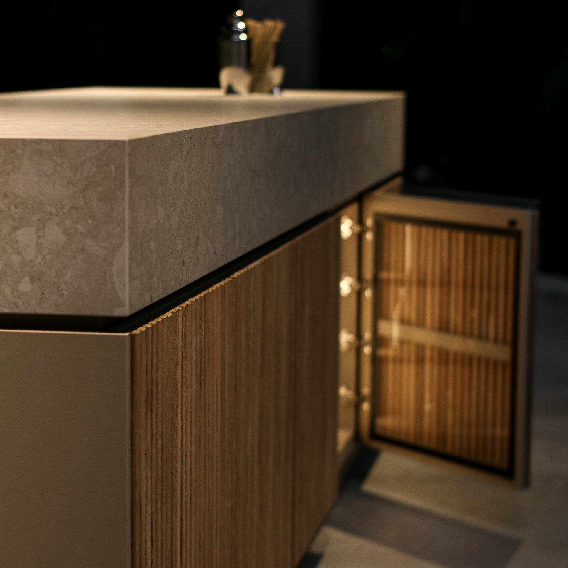 Floating Bar outdoor kitchen with stone surfaces and Iroko cabinetry