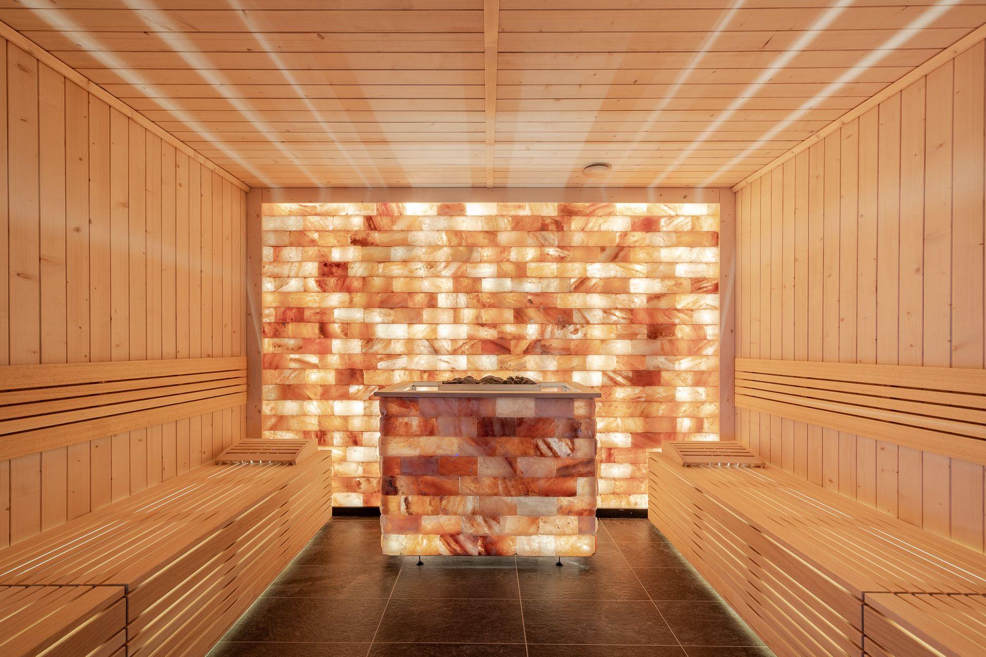 Bespoke sauna interior with a backlit Himalayan salt wall
