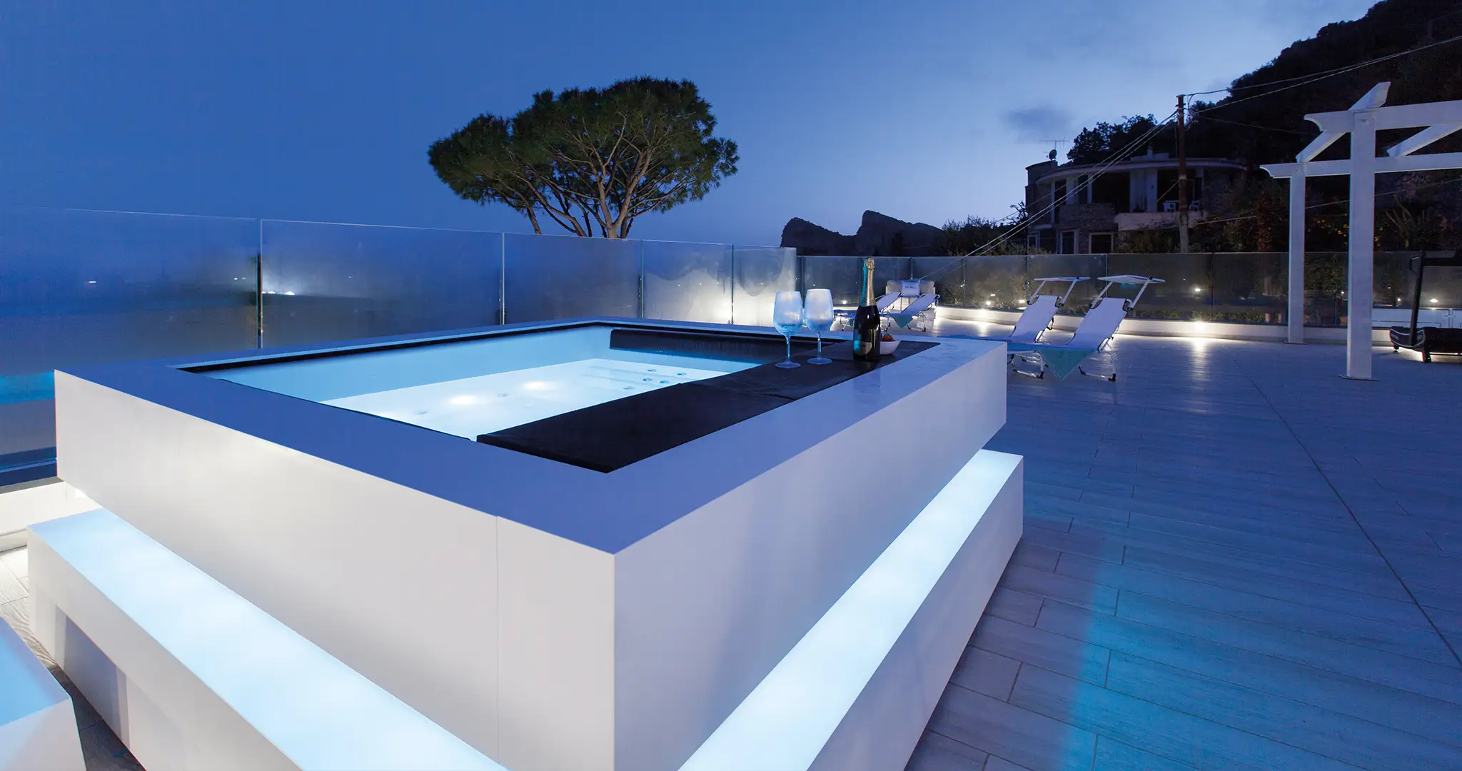 Cube hot tub installed in a contemporary outdoor setting